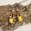 Zoom boucles d'oreilles jaune en liège et céramique 