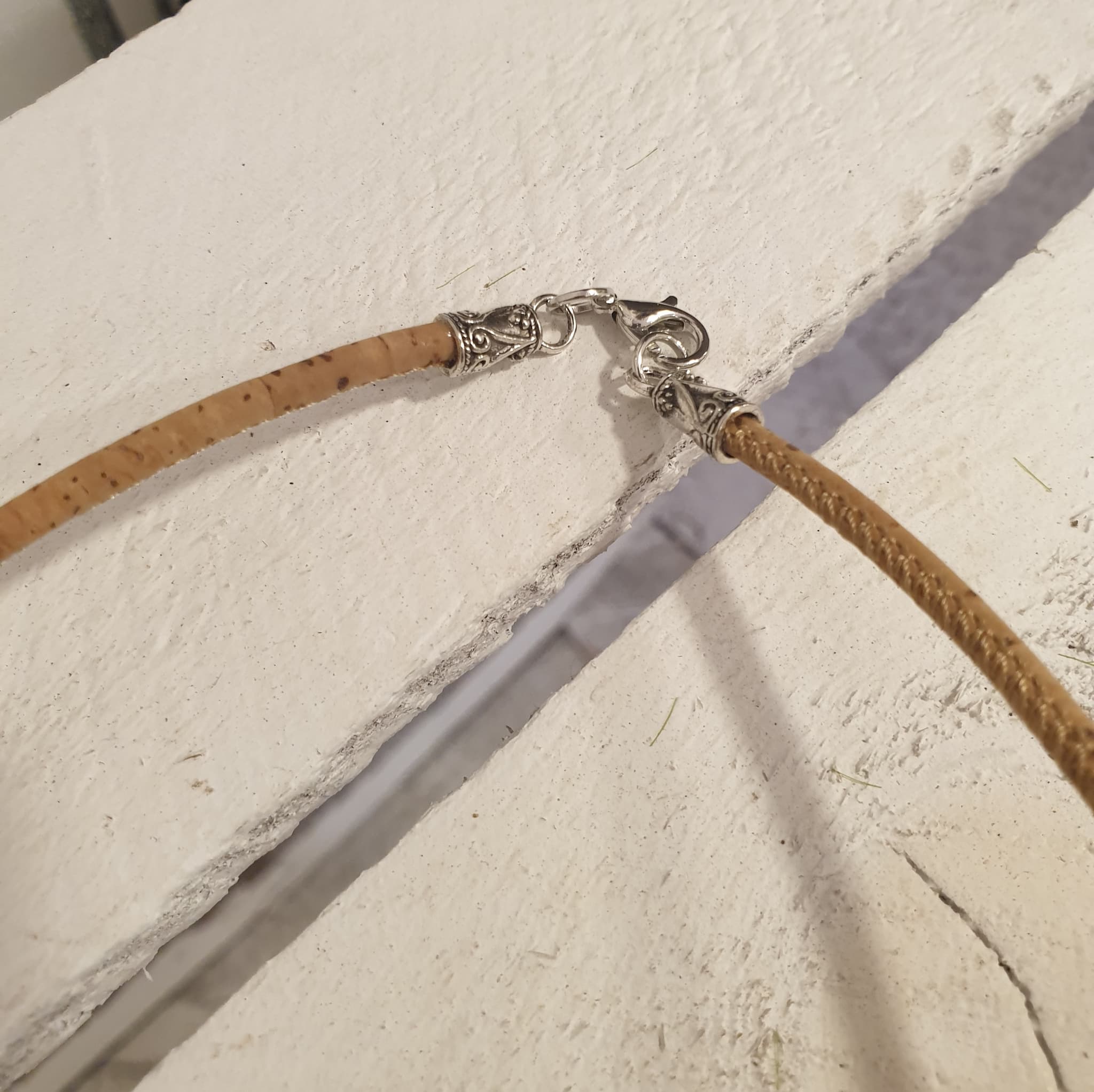 Zoom sur fermoir collier fleur de vie