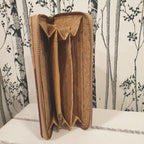 Tirette centrale zippée pour la monnaie