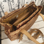 Intérieur du sac Eloria avec compartiments et poche zippée