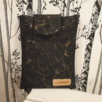 vue avant pochette à livre noir doré