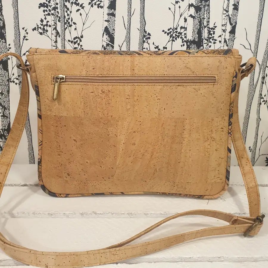 vue arrière du sac bandoulière montrant la pochette zippée